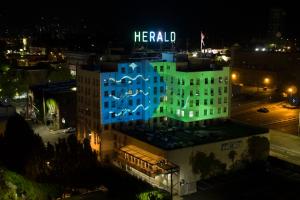 The Bellingham flag projected onto the Herald building at night