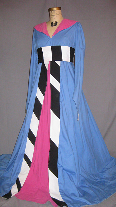 very long cornflower dress with fuscia accents. bold black and white belt.