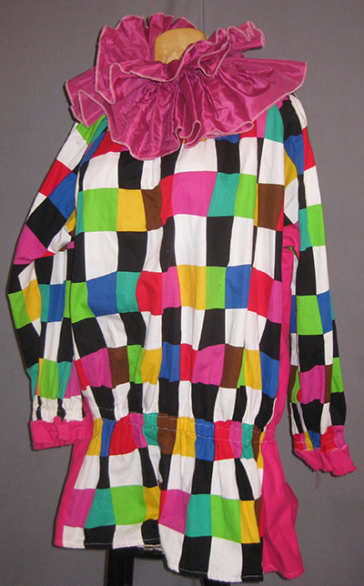 clownish quilted smock with sleeves and pink neck ruffles