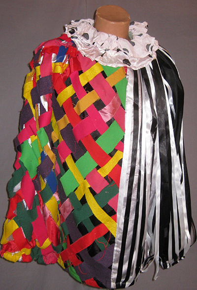 Jester jacket with ruff collar. Half multicolor lattice, half black and white striped silk.