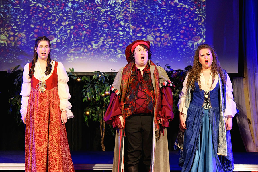 singers in renaissance costumes against a starry backdrop