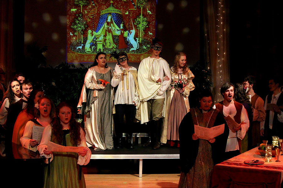 crowd finale scene. a dozen opera singers in renaissance costume