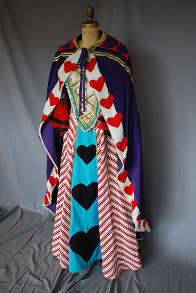 Queen of Hearts costume from Alice in Wonderland. Royal cloak, dress, heart motif.