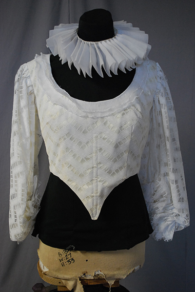 Short white bodice with narrow sleeves and neck ruff
