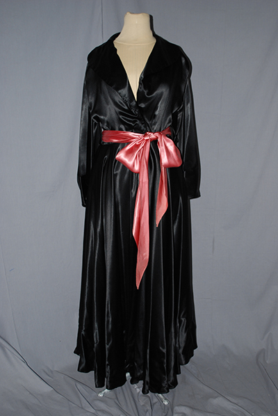 black silk robe with rose colored ribbon in a bow at waist