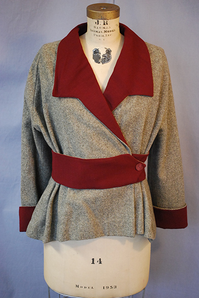 1940s Victory Suit style jacket. Grey with burgundy lapels, belt, and cuffs.