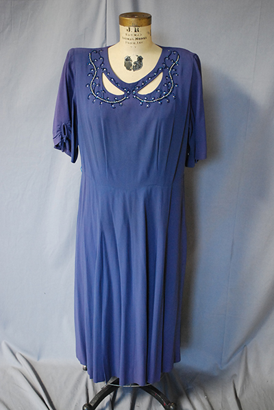 simple violet dress with elegantly styled neckline