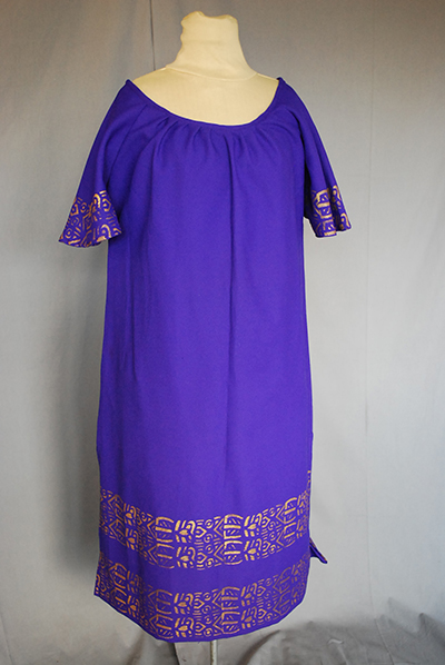 bright purple tunic with short sleeves and metallic pattern at sleeves and hem