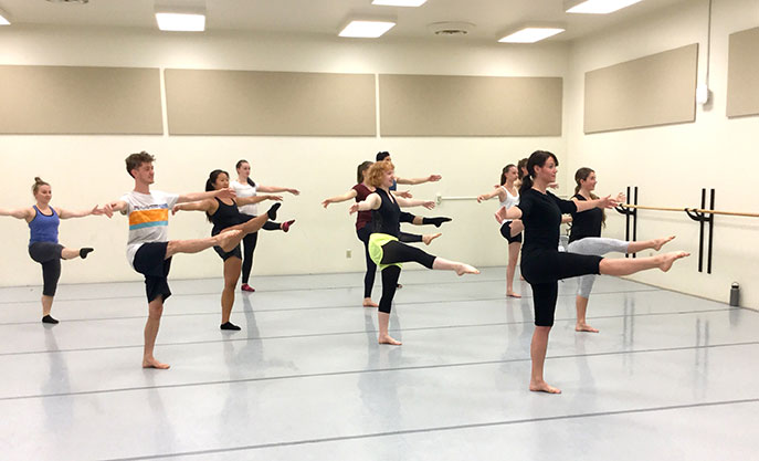 A group of students doing ballet turns