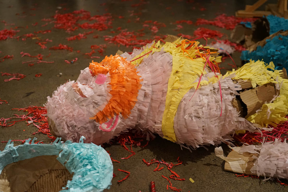 a self portrait of Ryan in the form of a broken pinata on the ground