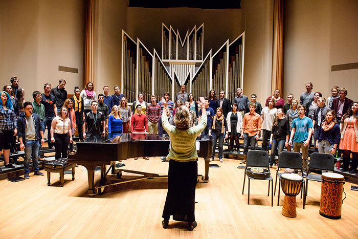 a choir rehearsal in front of the pipe organ