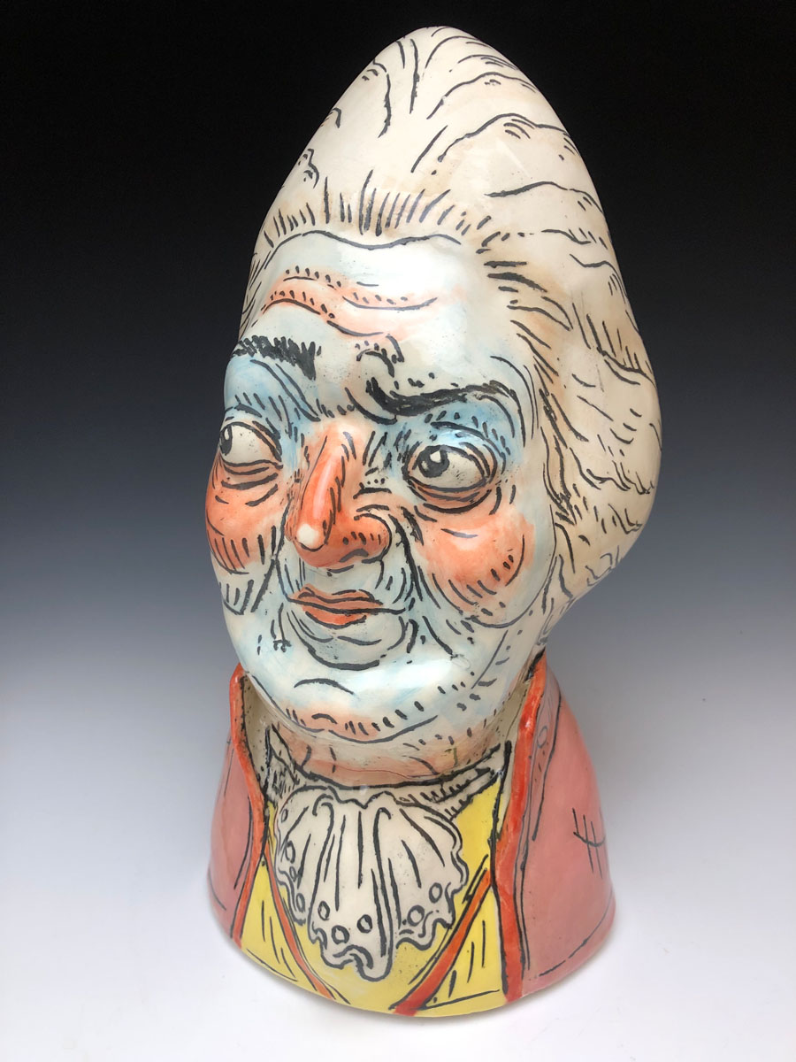 ceramic bust of grotesquely smug aristocrat