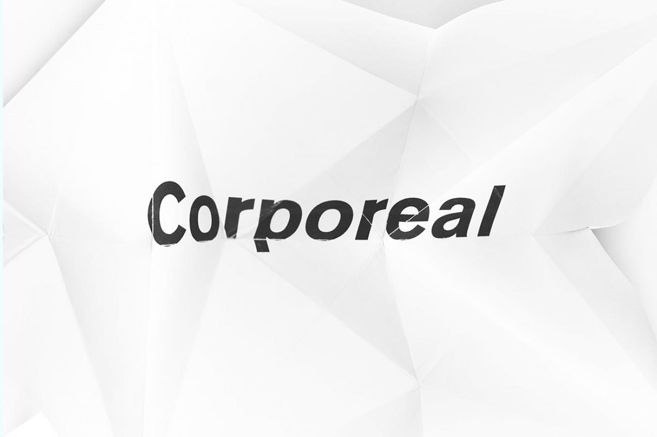 the word &quot;corporeal&quot; appears to be printed on a crumpled paper
