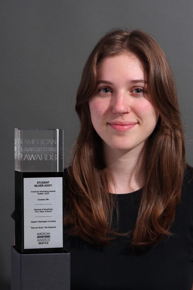 a young person holding an award