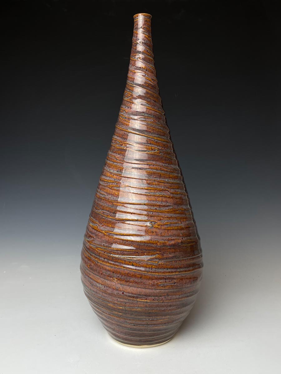 a tall, tapering ceramic vase