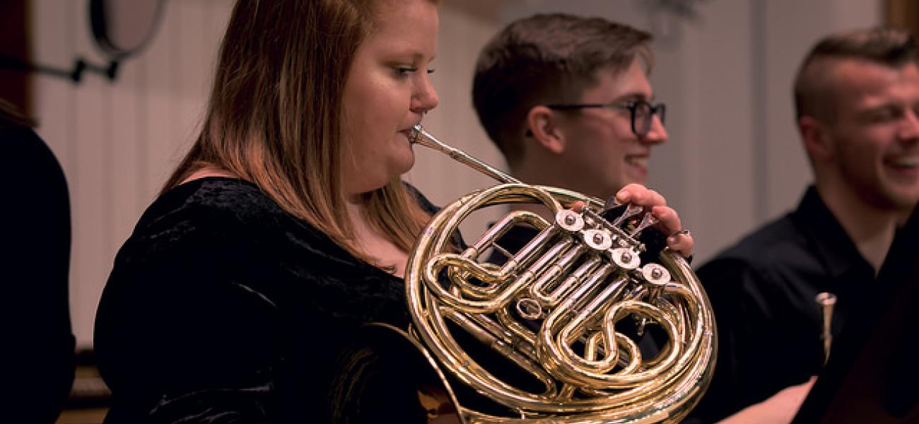 Close-up of a woman playing french horn in the Western Band