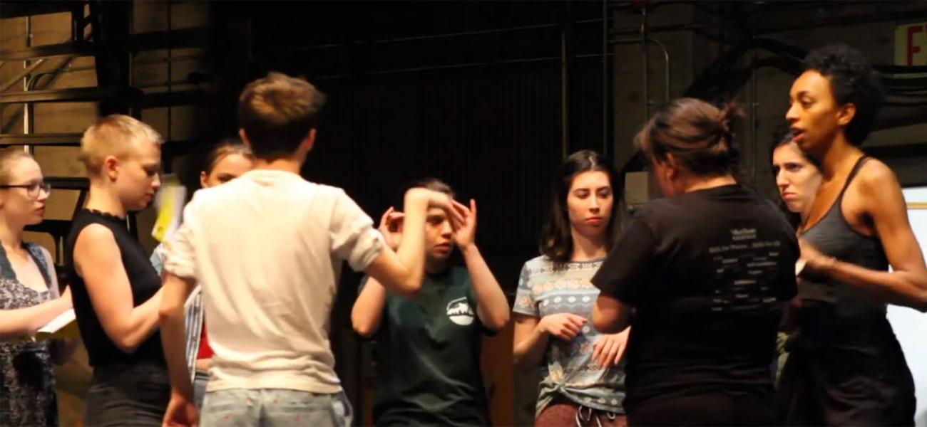 a group of students rehearse for a theatre production