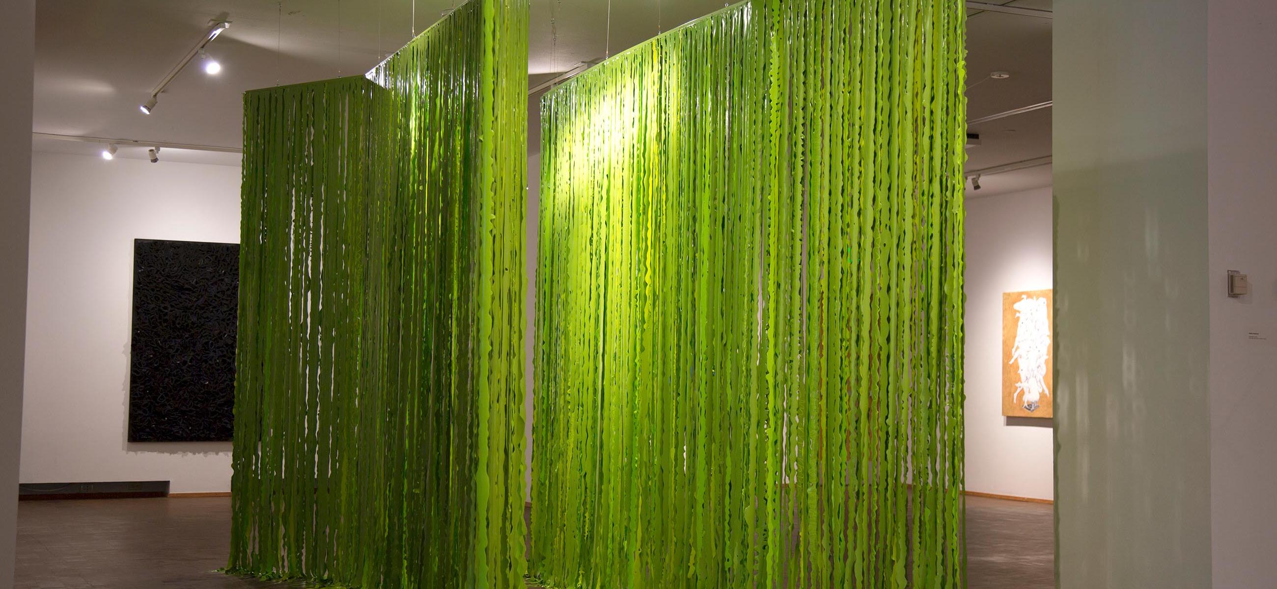 slick green drapes in a gallery