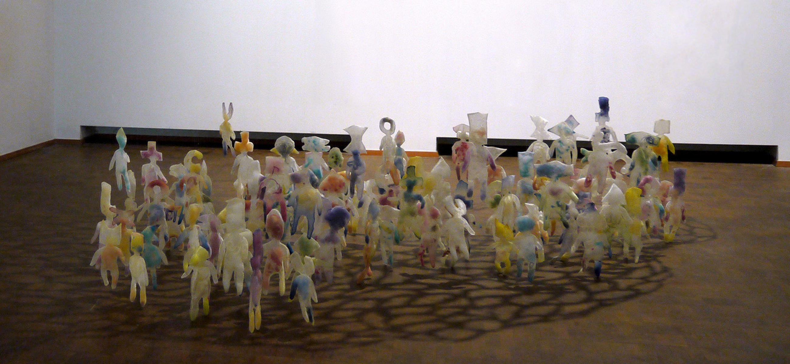 humanoid figures grouped below a floating net