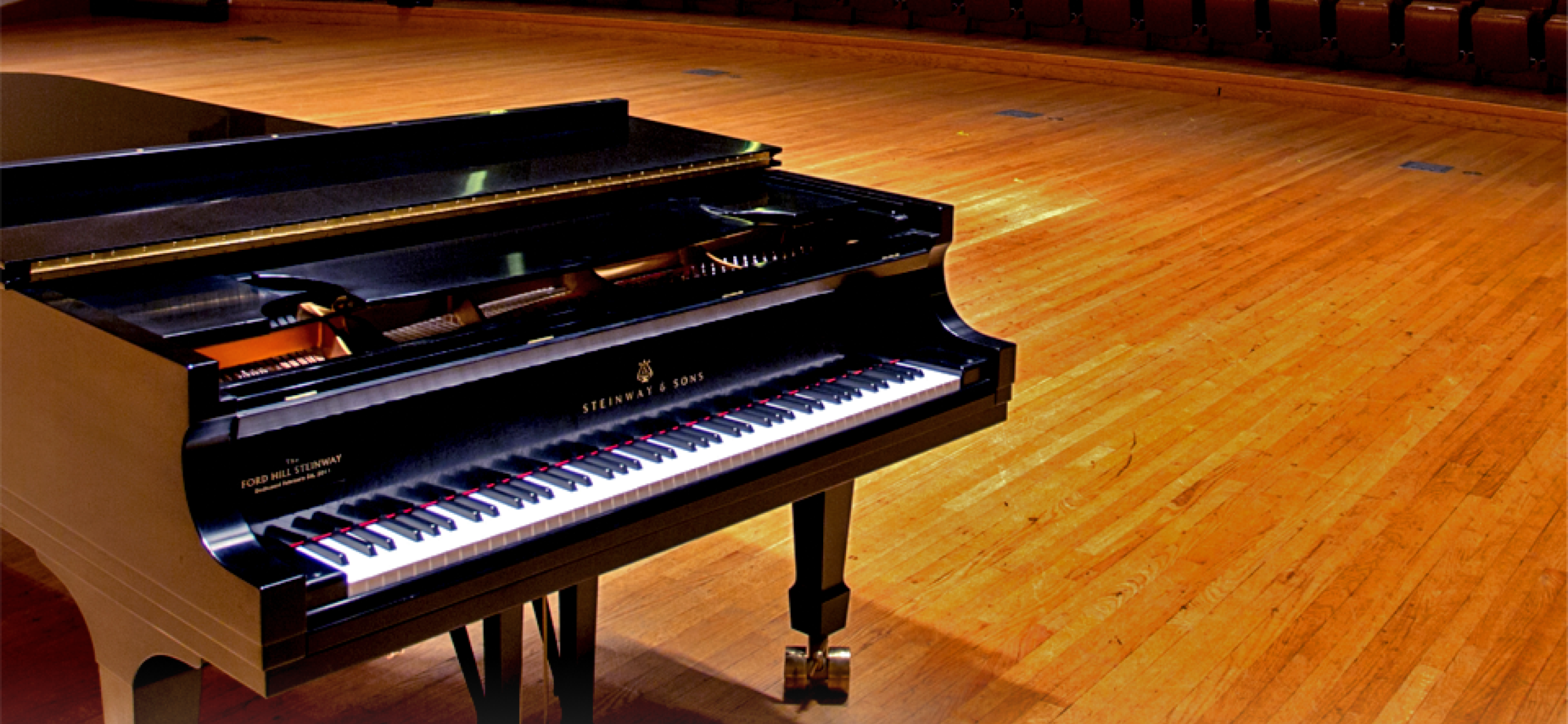 a grand piano in a concert hall