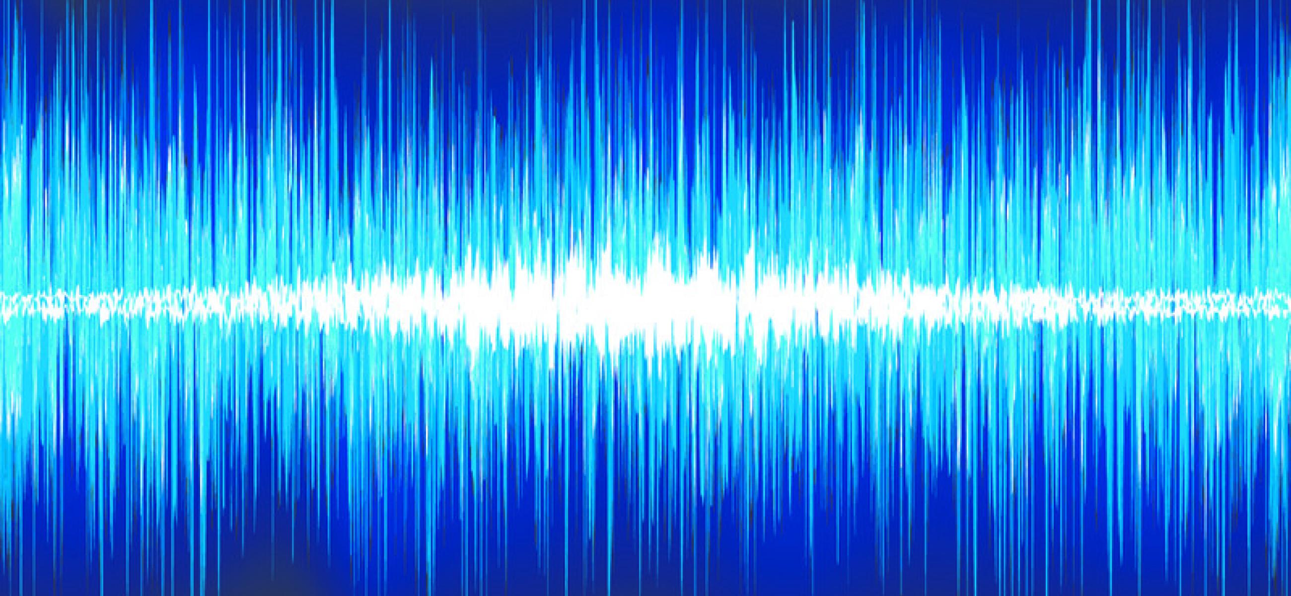 A sound wave radiates in blue across a dark background