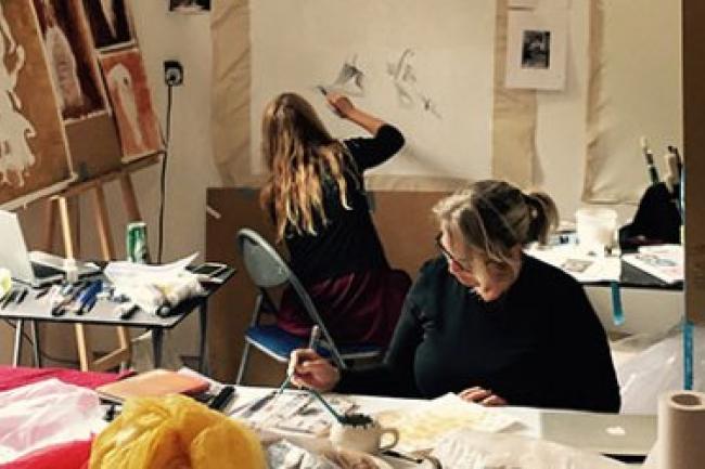 Two women drawing in a studio