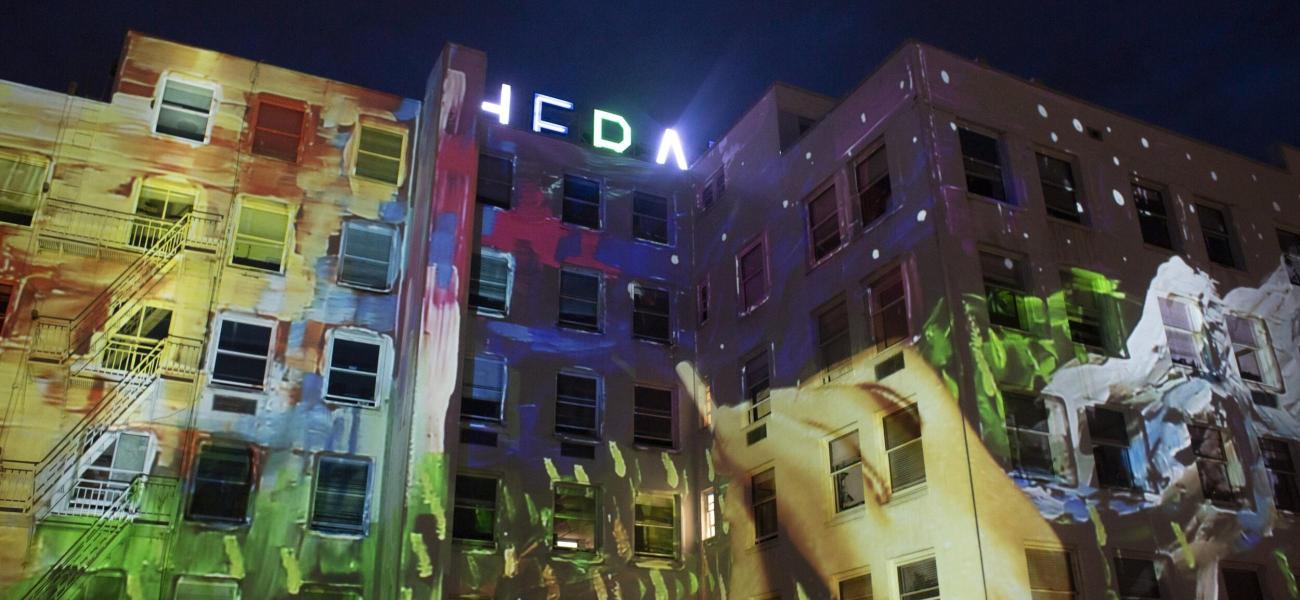 paint strokes projected up onto the Herald building