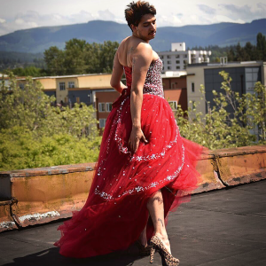 j. chavez posing in a gown and high heels