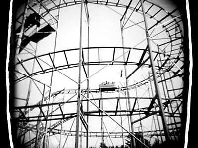 black and white photo of an old roller coaster