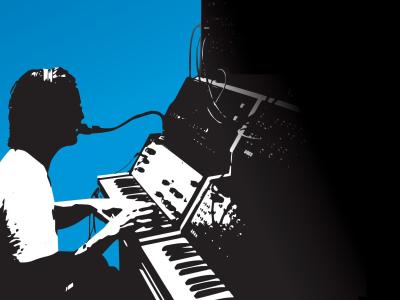 silhouette of a person operating an old music synthesizer