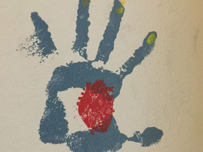 A handprint with an anatomically correct heart painted over the palm of the hand