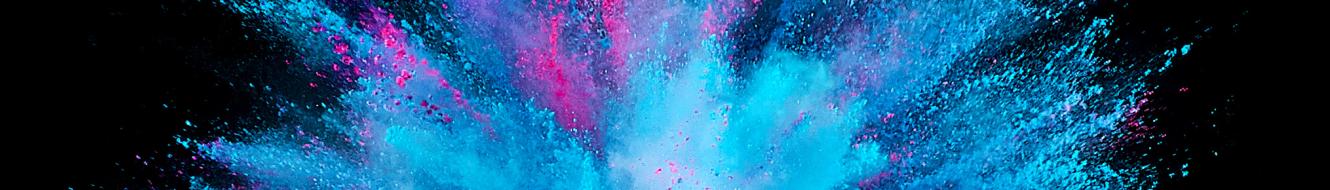 A firework shaped explosion of blue and pink powder