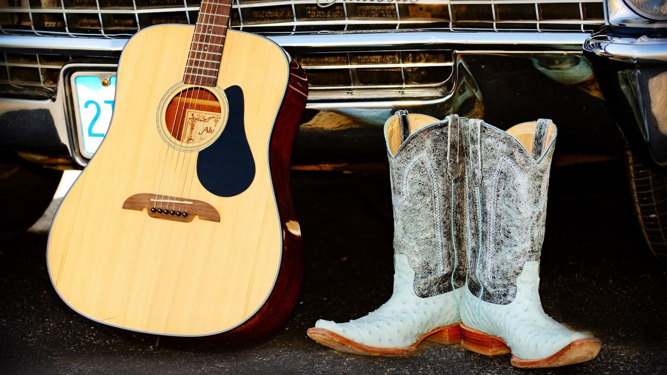 Chrome bumper, acoustic guitar, cowboy boots