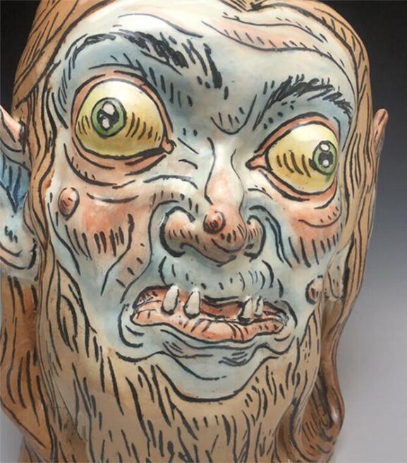 bug-eyed ceramic werewolf with underbite and pokey teeth
