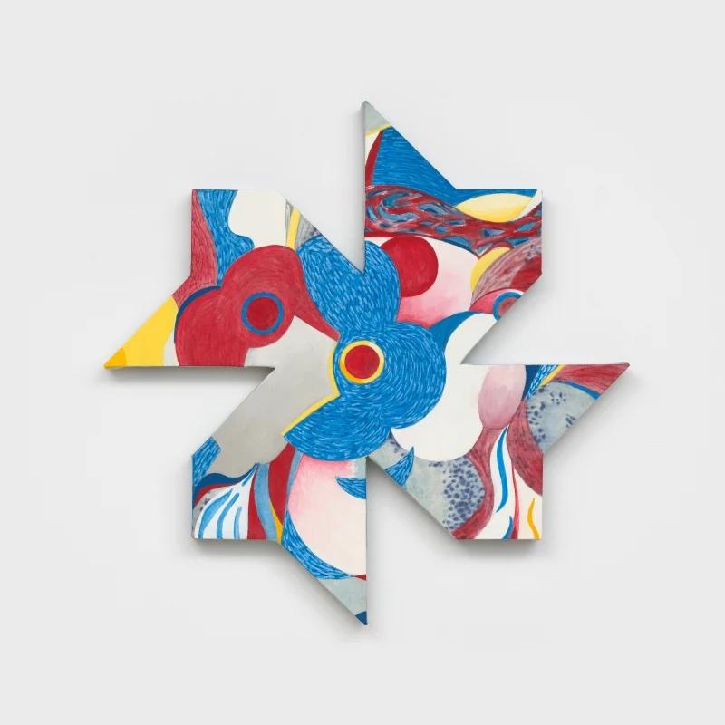 a pinwheel shaped painting with many colors