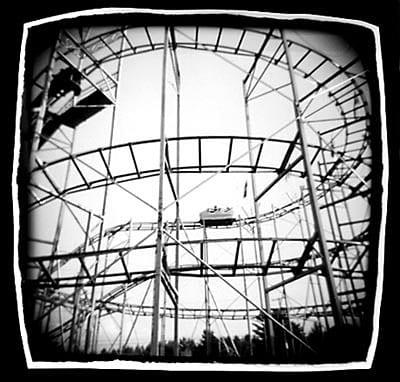 black and white photo of an old roller coaster