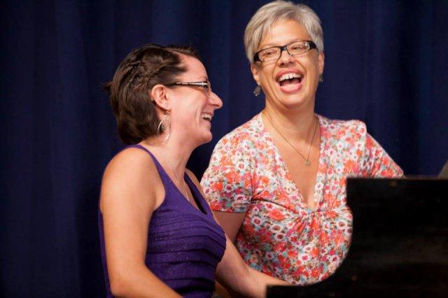 Kathleen Kelly and a student laughing together