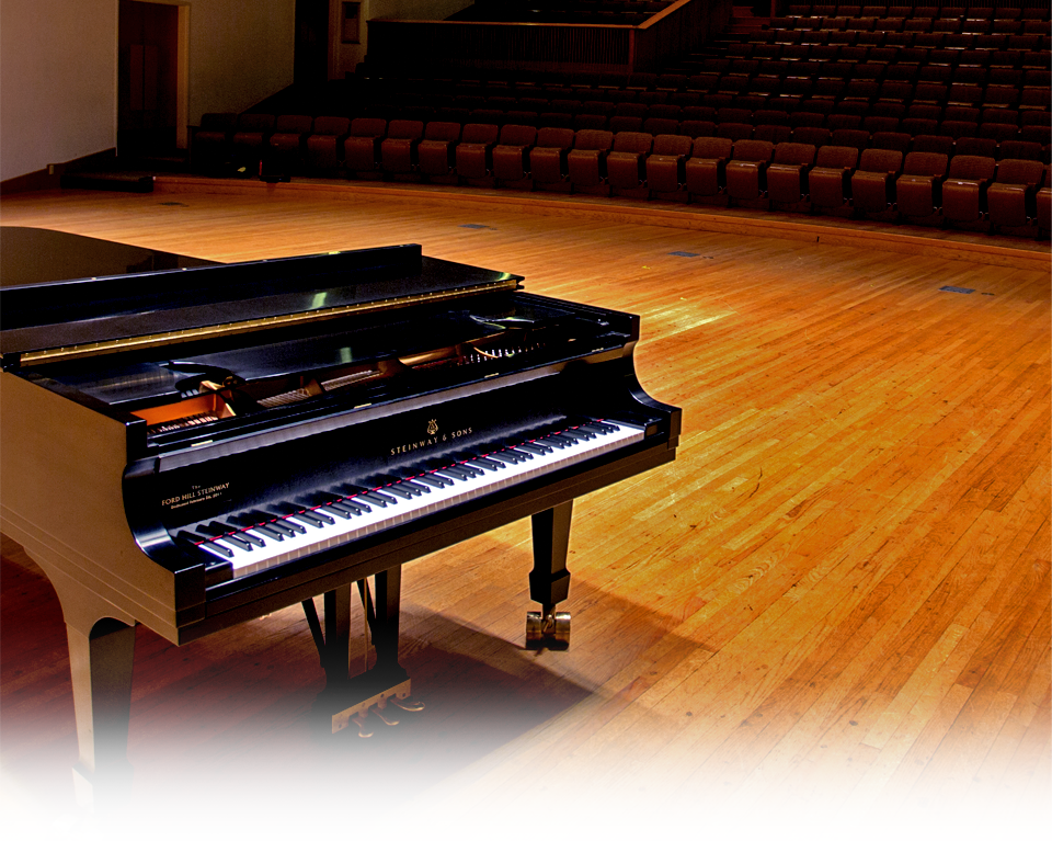 a grand piano in a concert hall