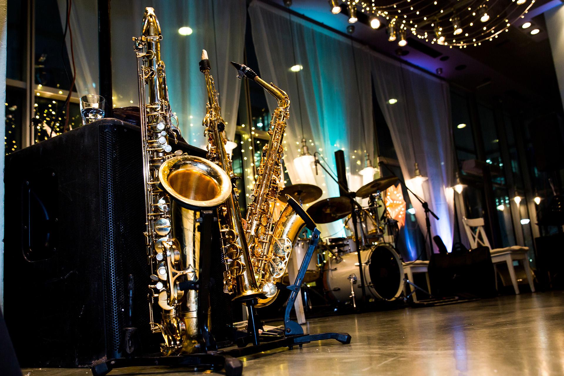 shiny jazz instruments set up on a moodlit stage