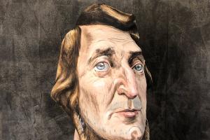 papier mache bust of Thoreau with the word disobey printed on fabric over the bust