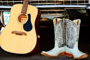 Chrome bumper, acoustic guitar, cowboy boots