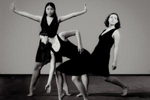 3 dancers close together in dramatic poses